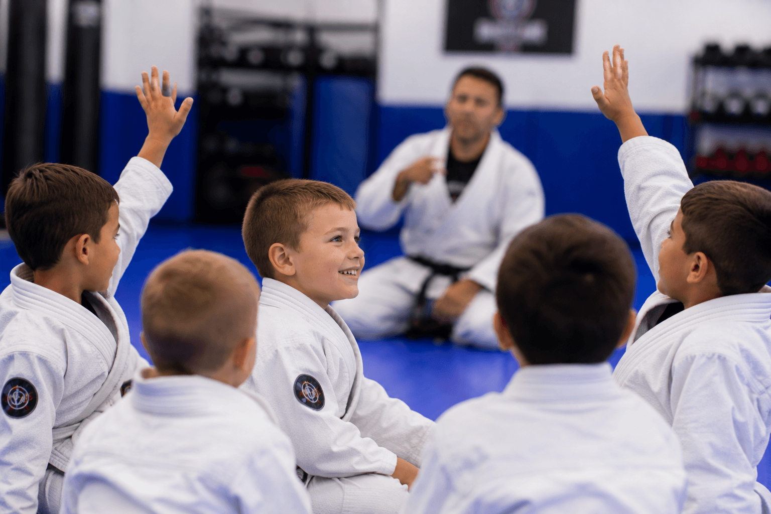 Adult student drilling punches on the pads at Master Pete's BJJ Academy
