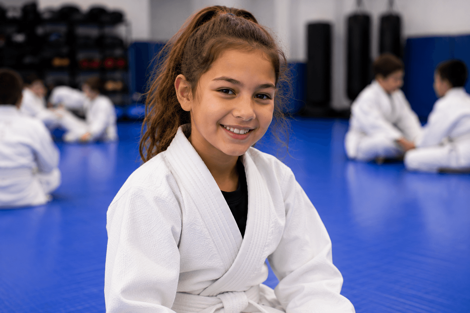 Adult member smiling during a kickboxing class at Master Pete's BJJ Academy
