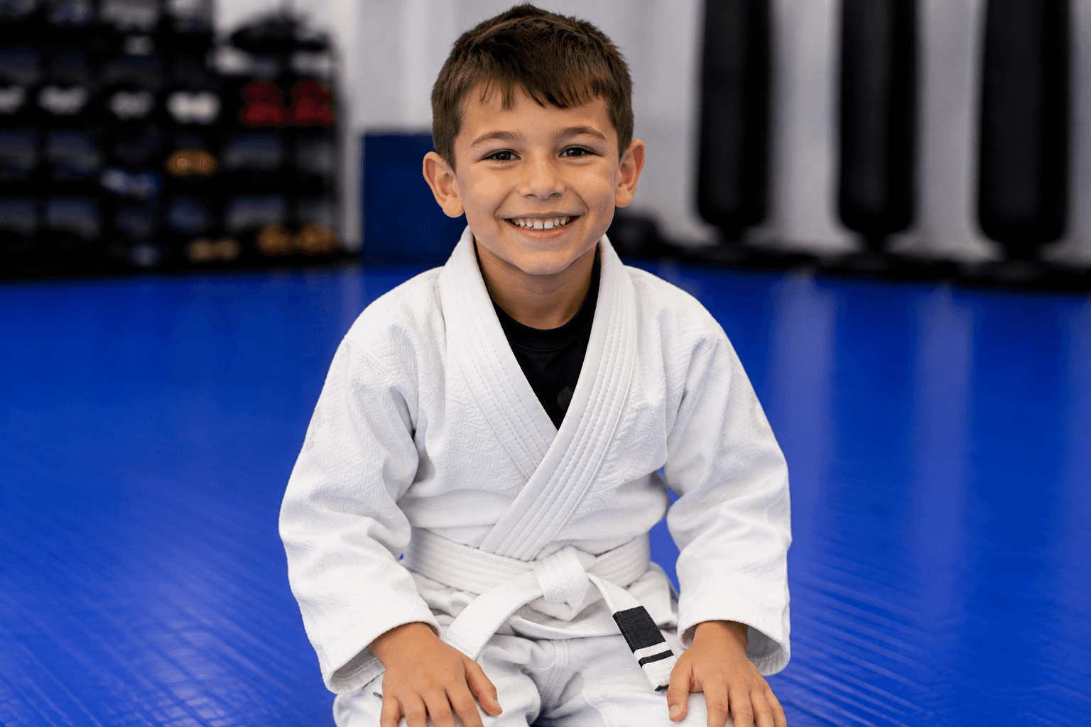 Smiling boy in a kids martial arts class at Master Pete's BJJ Academy