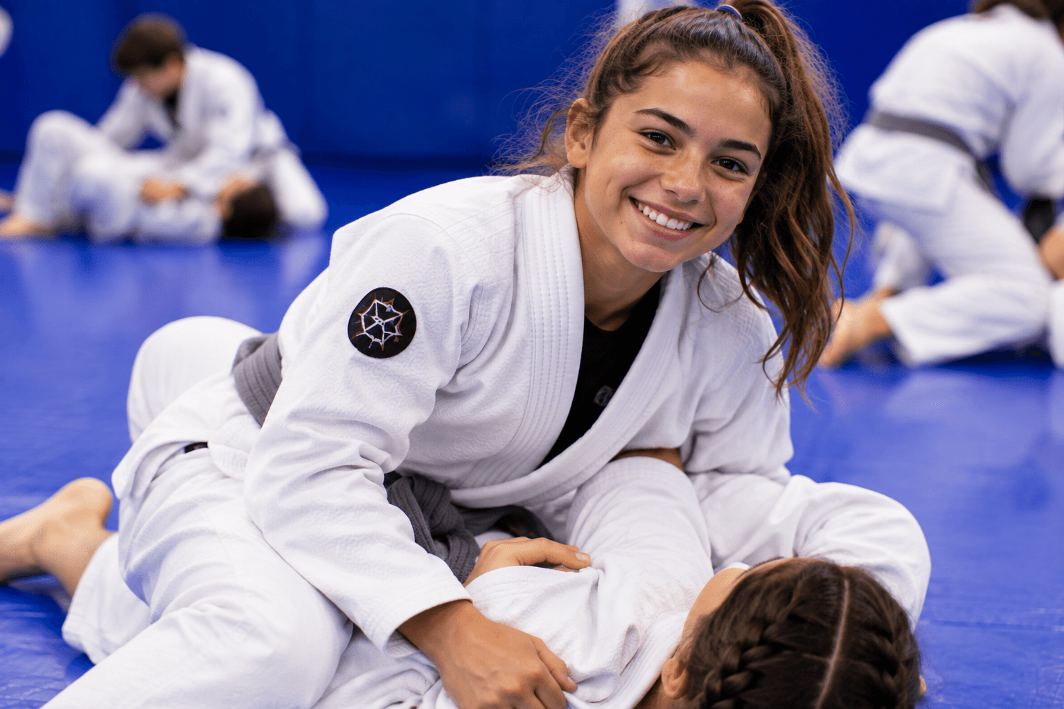 Young students training in boxing gloves during a Teens Brazilian Jiu-Jitsu class at Master Pete's BJJ Academy